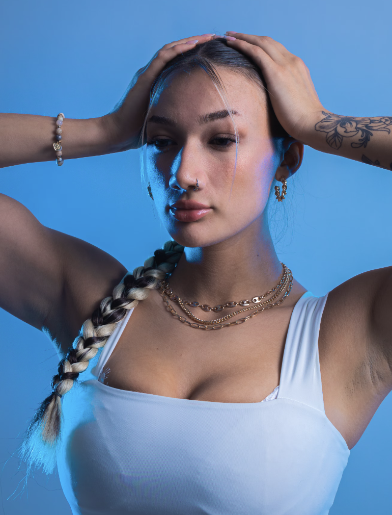 woman working out with necklaces and earrings